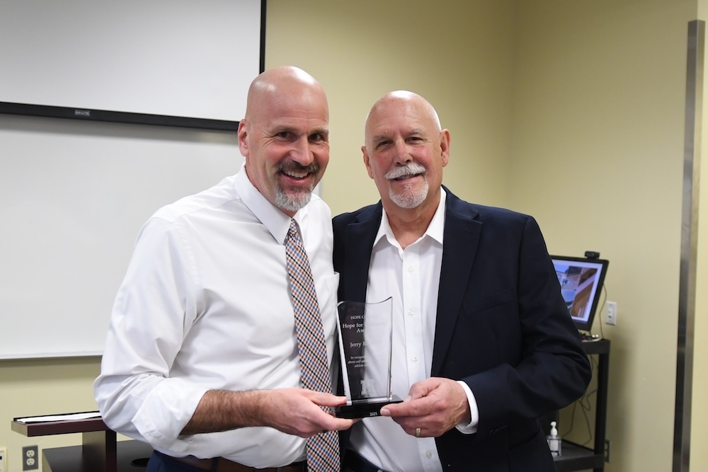 Athletic Director Tim Schoonveld with Hope for Humanity Award Recipient Jerry Root